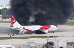 Jet carrying 101 people catches fire