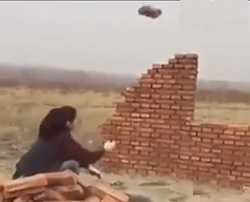 Lady using her Hand as a Hammer