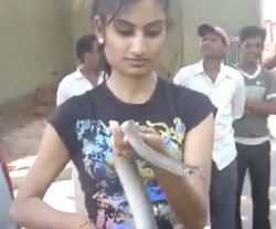 Dare Woman playing with Snake